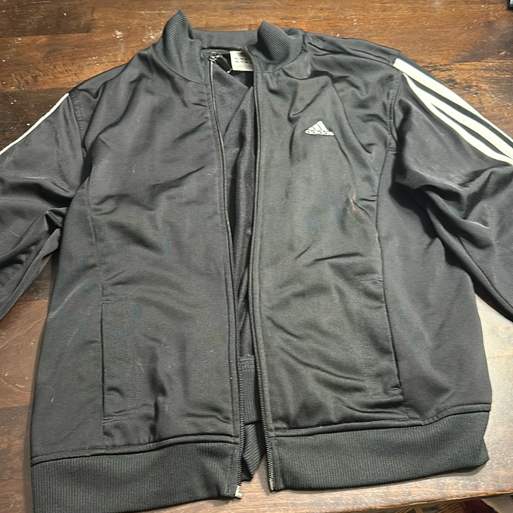 Adidas women’s black jogger zip up with white strips on arms
